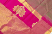 Kanchi silk brocade saree in olive green with floral motifs in border and a rich pallu