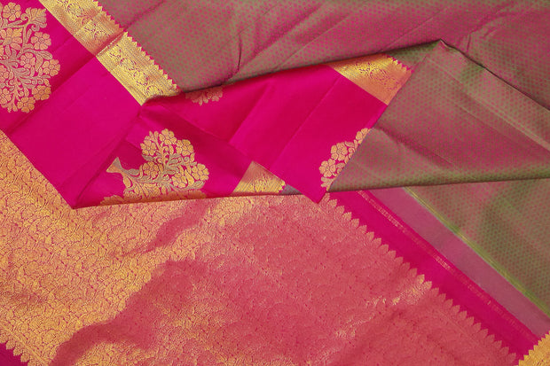 Kanchi silk brocade saree in olive green with floral motifs in border and a rich pallu