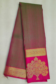 Kanchi silk brocade saree in olive green with floral motifs in border and a rich pallu