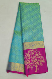 Kanchi silk brocade saree in teal green with floral motifs in border and a rich pallu