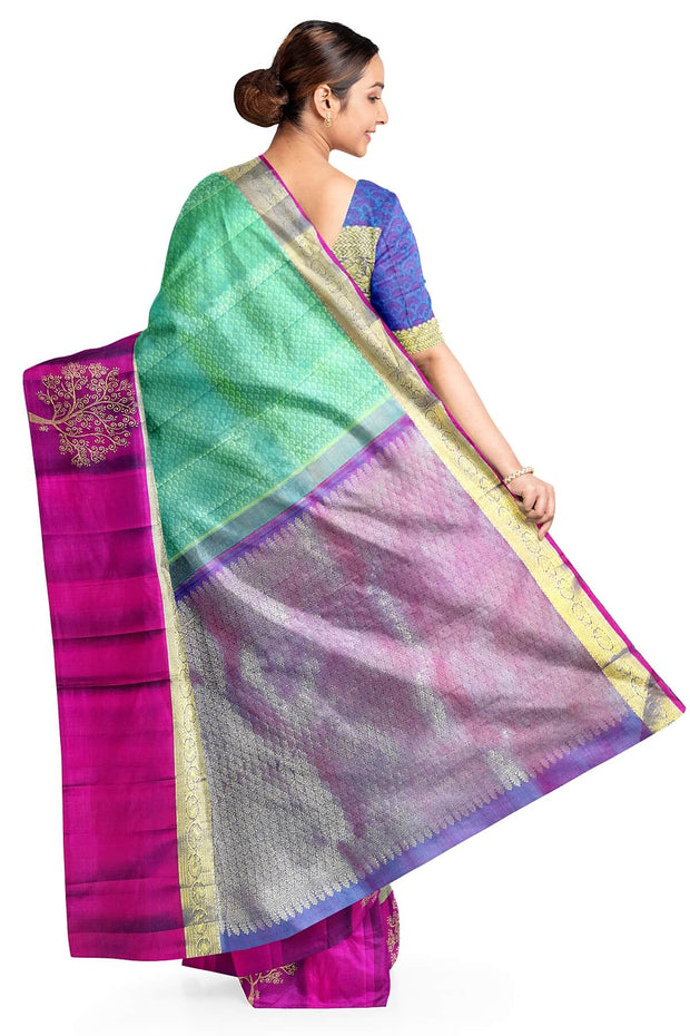 Kanchi silk brocade saree in teal green with floral motifs in border and a rich pallu