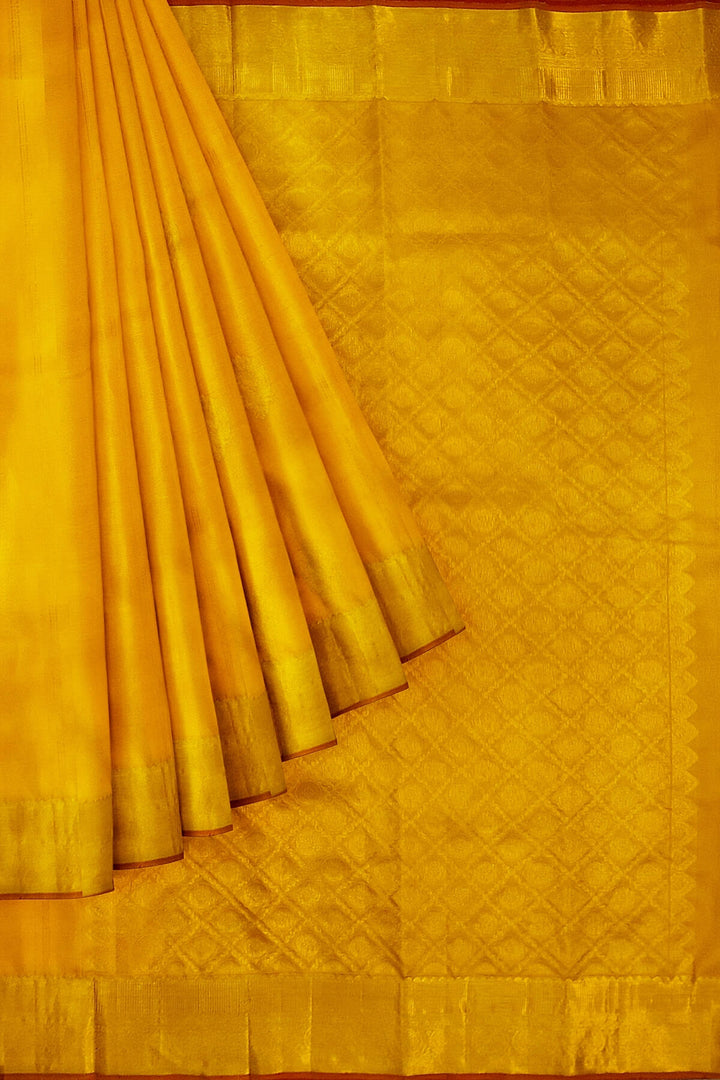 Kanchi pure silk saree in yellow with floral motifs on the body,