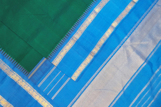 Kanchi pure silk saree in peacock green with  double border and a contrast pallu