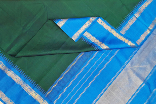 Kanchi pure silk saree in peacock green with  double border and a contrast pallu