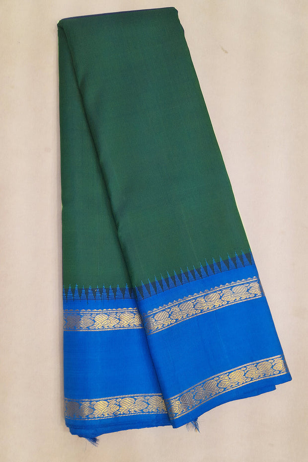 Kanchi pure silk saree in peacock green with  double border and a contrast pallu