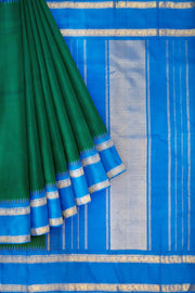 Kanchi pure silk saree in peacock green with  double border and a contrast pallu
