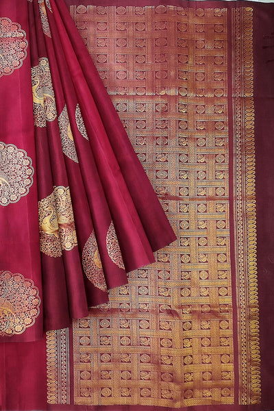 Kanchi soft silk saree in maroon with peacock motifs in gold