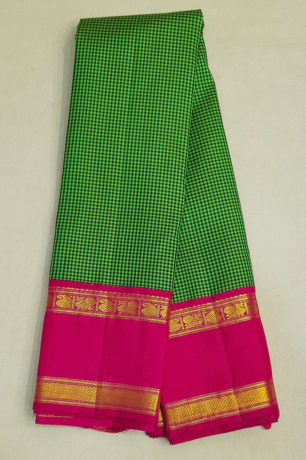 Kanchi pure silk sare in green & black checks  with double border