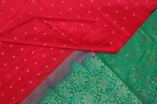 Kanchi soft silk saree in red with small motifs on the body and floral vines in pallu