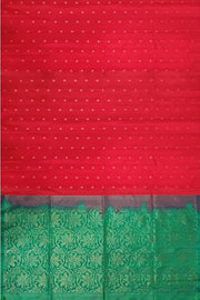 Kanchi soft silk saree in red with small motifs on the body and floral vines in pallu