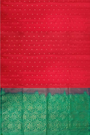 Kanchi soft silk saree in red with small motifs on the body and floral vines in pallu