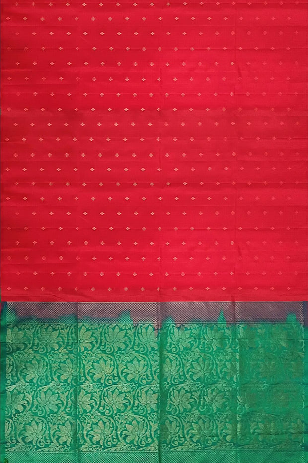 Kanchi soft silk saree in red with small motifs on the body and floral vines in pallu
