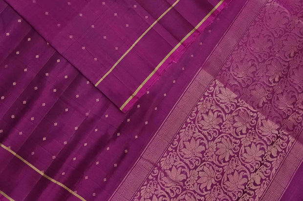 Kanchi soft silk saree in wine with small motifs on the body and floral vines in pallu