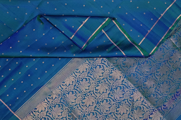 Kanchi soft silk saree in peacock blue with small motifs