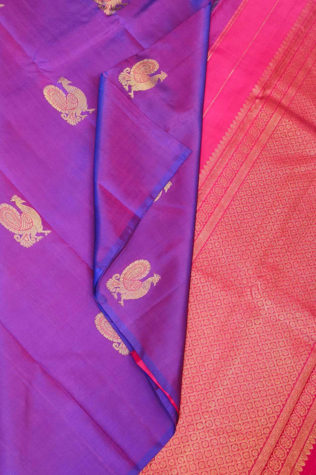 Kanchi borderless pure silk saree in  purple  with peacock motifs