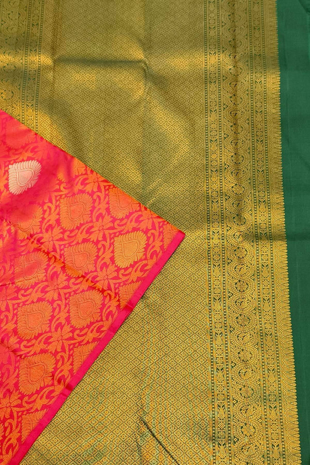 Kanchi  pure silk  brocade saree in pink  with floral vines and  motifs in gold & silver