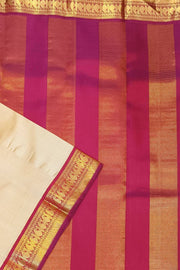 Kanchi pure silk saree in beige with  paisley motifs in the border