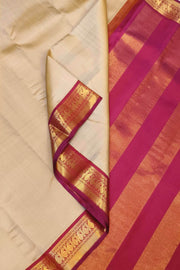 Kanchi pure silk saree in beige with  paisley motifs in the border
