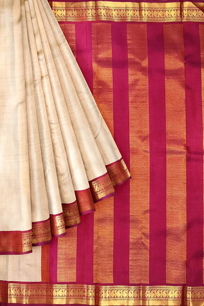 Kanchi pure silk saree in beige with  paisley motifs in the border