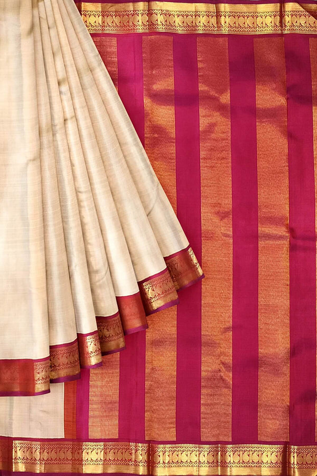Kanchi pure silk saree in beige with  paisley motifs in the border