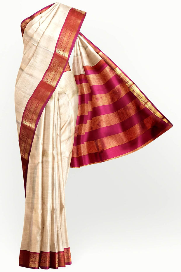 Kanchi pure silk saree in beige with  paisley motifs in the border