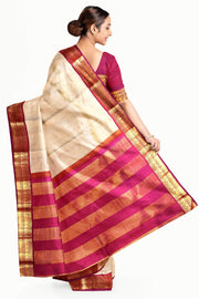 Kanchi pure silk saree in beige with  paisley motifs in the border