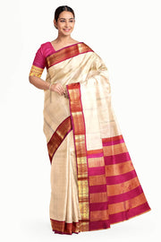 Kanchi pure silk saree in beige with  paisley motifs in the border
