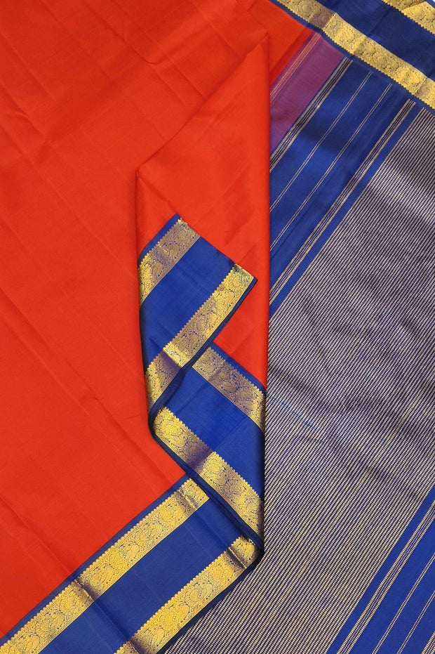 Kanchi pure silk saree in red  with a  retapet border
