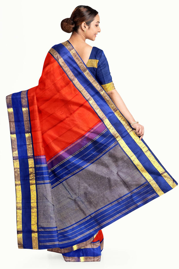 Kanchi pure silk saree in red  with a  retapet border