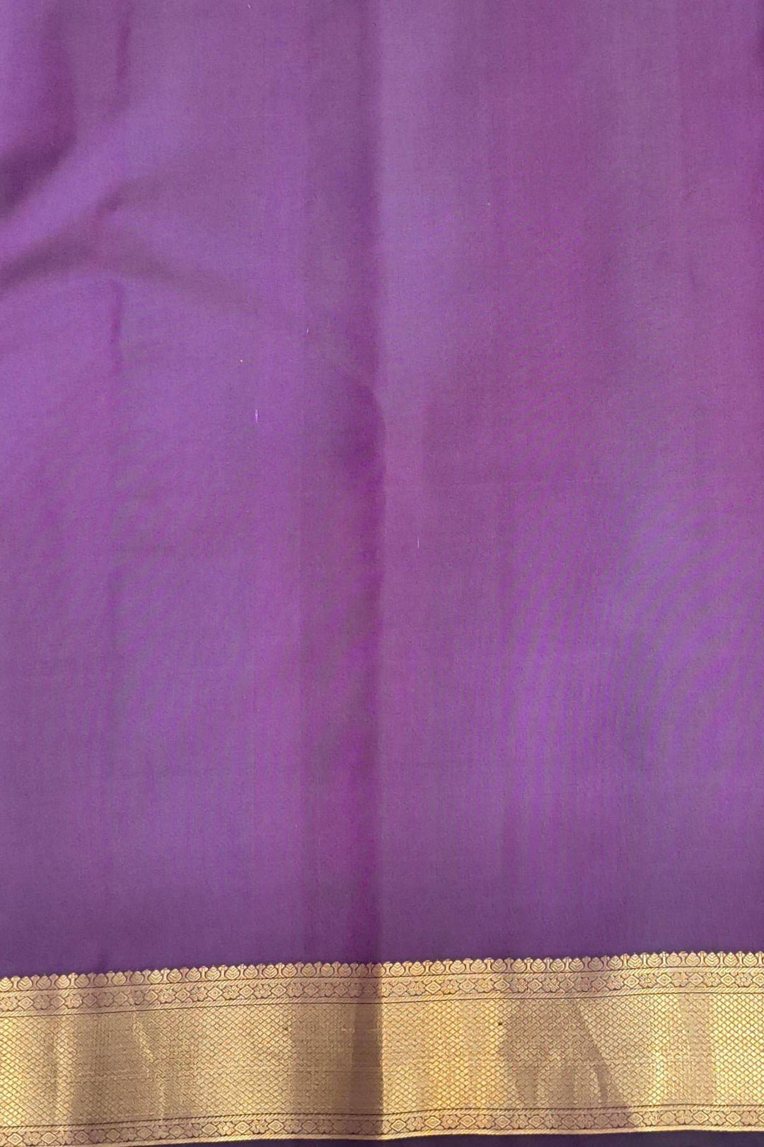 Kanchi pure silk saree in purple with floral motifs