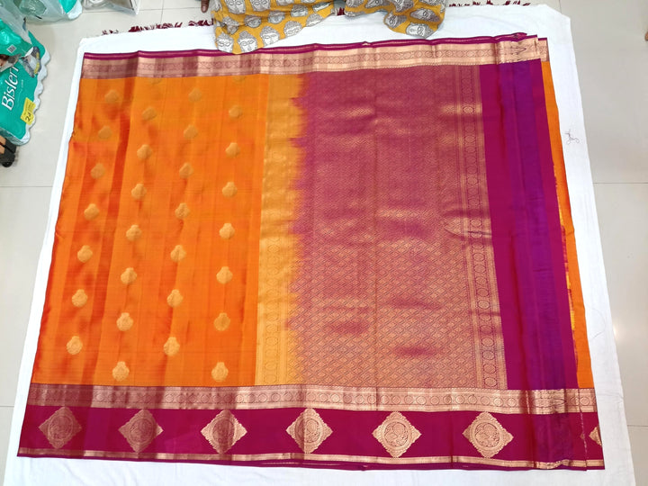 Kanchi silk saree in yellow with buttis