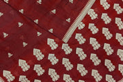 Mulberry raw silk saree in maroon with floral motifs all over the body.