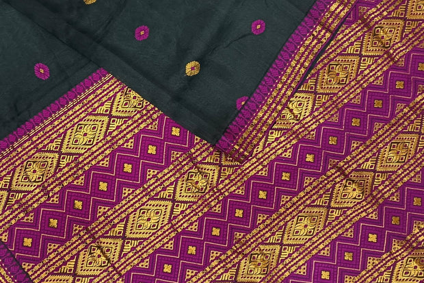 Mulberry raw silk saree in black with floral motifs all over the body.