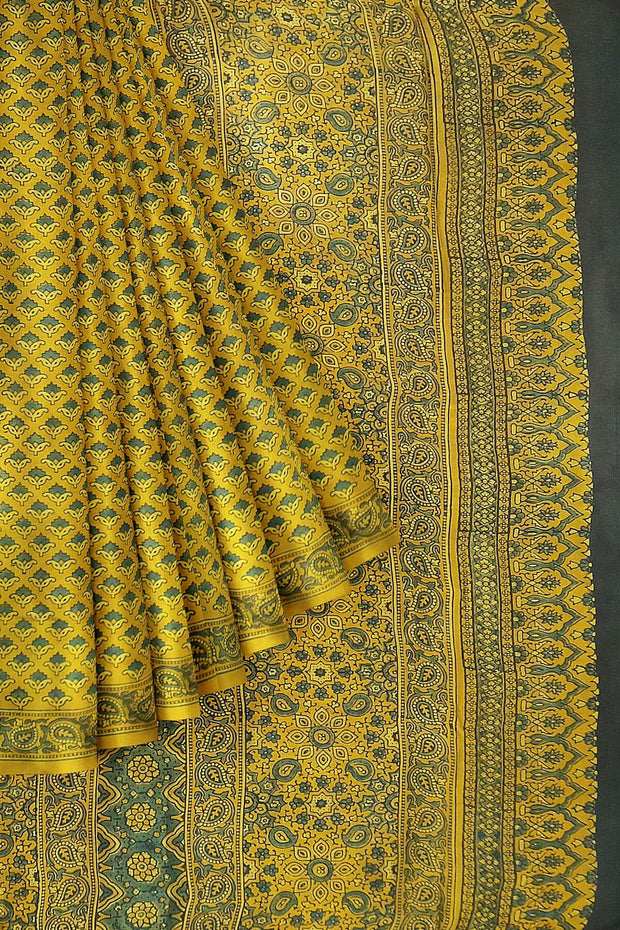 Modal silk saree in ajrakh block print in yellow  in floral pattern