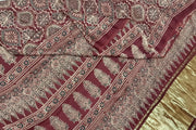 Modal silk saree in maroon with floral motifs  in hand block ajrakh print