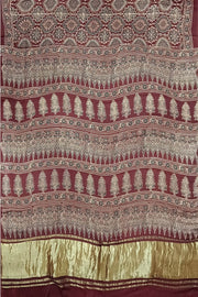 Modal silk saree in maroon with floral motifs  in hand block ajrakh print
