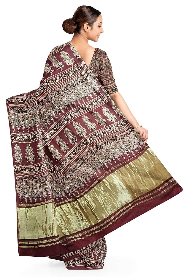 Modal silk saree in maroon with floral motifs  in hand block ajrakh print
