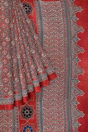Modal silk saree in red with  narikunj pattern in hand block ajrakh print