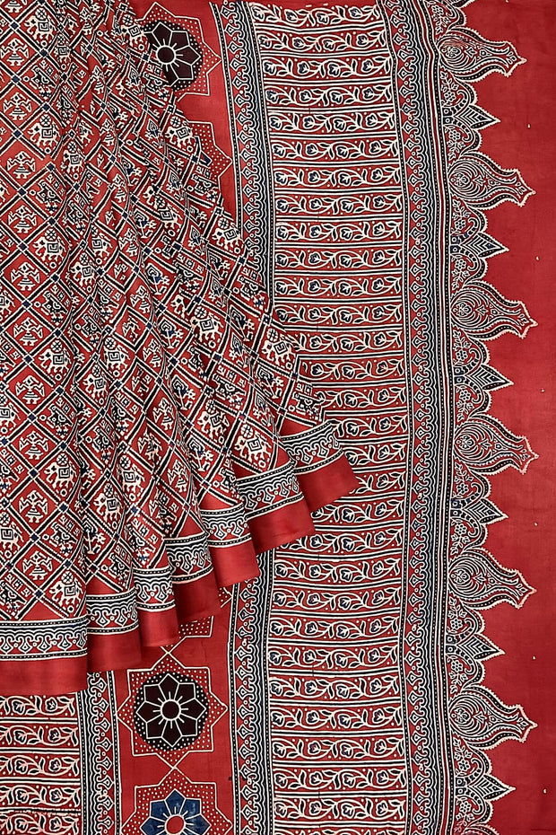 Modal silk saree in red with  narikunj pattern in hand block ajrakh print