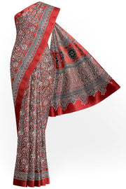 Modal silk saree in red with  narikunj pattern in hand block ajrakh print
