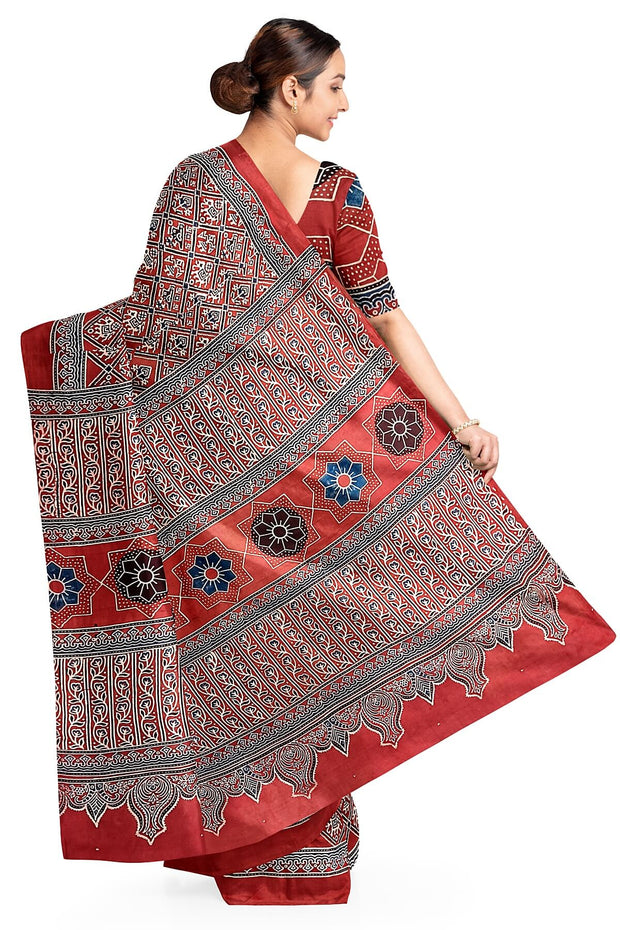 Modal silk saree in red with  narikunj pattern in hand block ajrakh print
