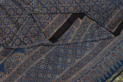 Modal silk saree in blue with floral motifs  in hand block ajrakh print and a tissue pallu