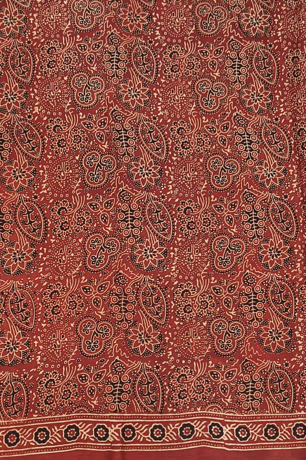 Modal silk saree  in red with  round motifs in hand block ajrakh print.