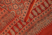 Modal silk saree  in red with  round motifs in hand block ajrakh print.