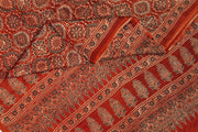 Modal silk saree  in red with  round motifs in hand block ajrakh print.