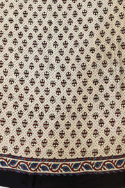 Modal silk saree in off white with lotus motifs in hand block ajrakh print