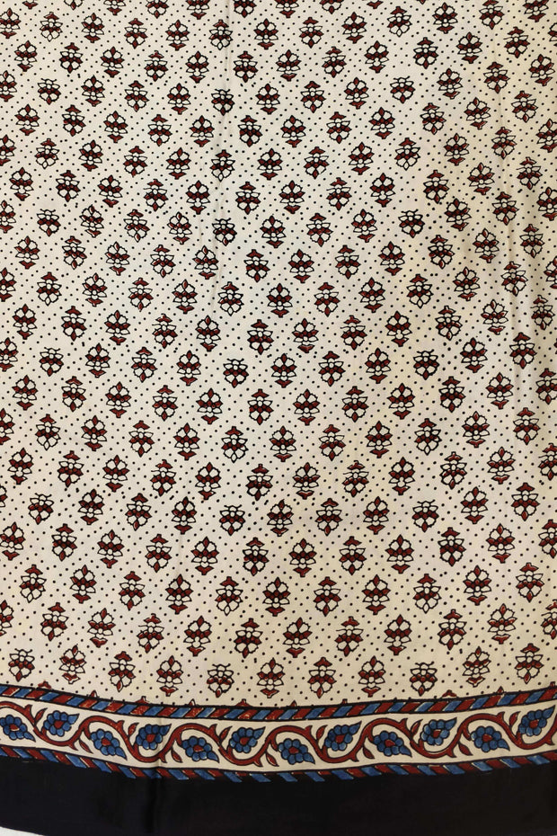 Modal silk saree in off white with lotus motifs in hand block ajrakh print