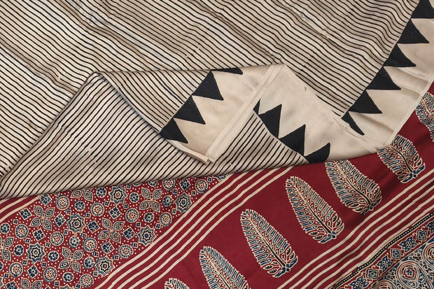 Modal silk saree  in cream with  stripes in hand block Ajrakh print.
