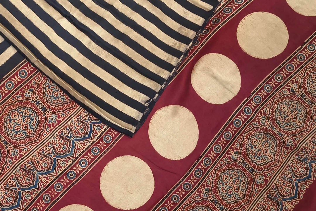 Modal silk saree in cream with stripes  and hand block print ajrakh pallu