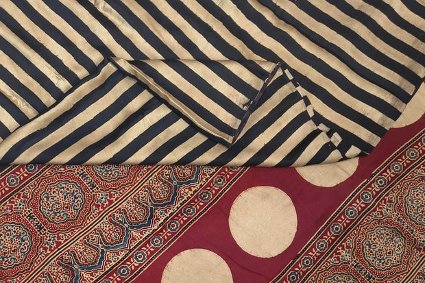 Modal silk saree in cream with stripes  and hand block print ajrakh pallu